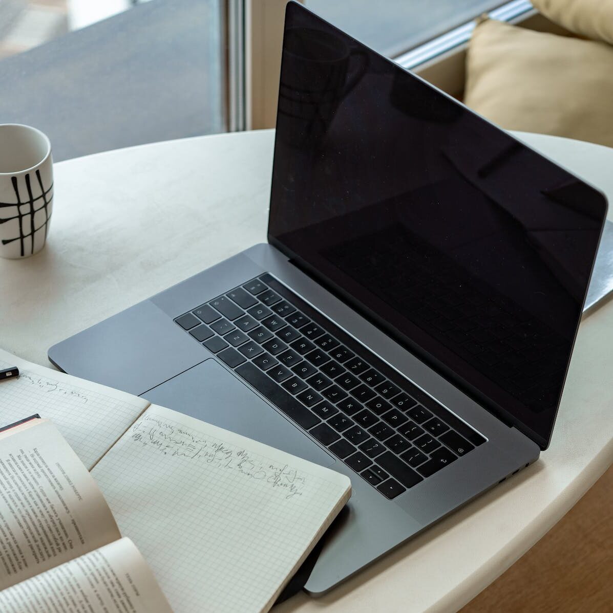 Macbook Pro on White Table